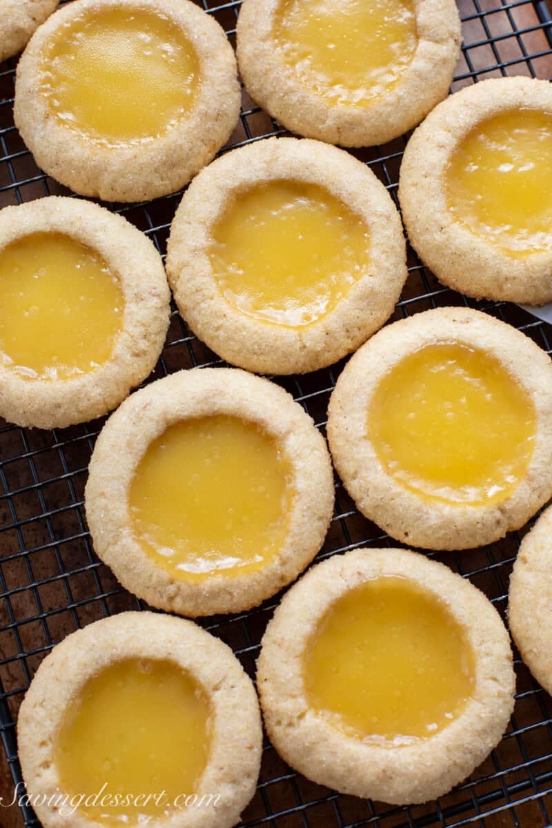 Key lime pie cookies cooling on a baking rack.