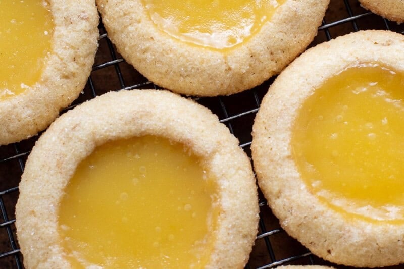 A close up of key lime pie cookies on a cooling rack.