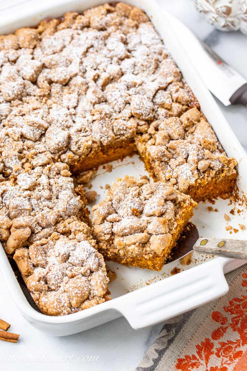 An overhead view of a pumpkin crumb cake in a baking dish.