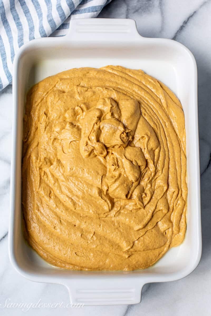 Pumpkin cake batter in a pan.